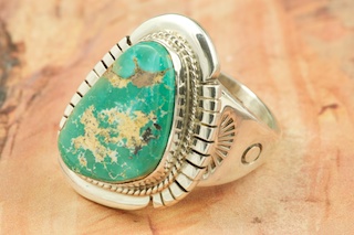 Genuine Royston Turquoise set in Sterling Silver Ring. Beautiful Matrix in this Turquoise Stone. The Royston Turquoise Mine is located in Nye County, Nevada. Created by Navajo Artist Larson Lee.